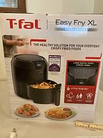Box for T-fal Easy Fry XL digital air fryer showing product image and features