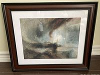 Front view of framed Turner print "Snow Storm" showing the detailed stormy sea and ship scene inside a dark wood frame with glass.