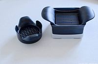 Photo of dicer and slicer side by side on a white surface, showing the cutting grids and handles