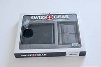 Front view of the Swiss Gear RFID blocking wallet and card holder set in original packaging