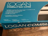 Close-up of the blue original box showing brand and model details with product features and model variations.