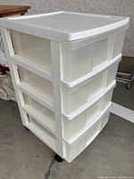 4-drawer white plastic storage cart on casters, with translucent drawers and flat top