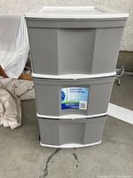 Front view of one storage tower showing all 3 drawers closed with a Blue Planet label on the middle drawer.