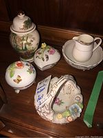 Five porcelain items arranged including temple jar, two trinket dishes, Mikasa creamer and bowl, and Dresden footed dish.