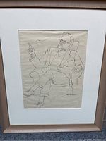 Full frontal view of framed ink sketch