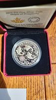 Photo of the 2015 Royal Canadian Mint $15 silver coin in its red display box with certificate of authenticity.