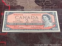 Front side of the 1954 Canadian 2 Dollar Banknote showing full note with serial number and Queen Elizabeth II portrait.