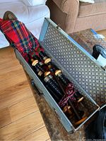Open case showing full set of bagpipes inside
