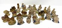 Wide group photo showing all 34 ceramic figurines from various nursery rhymes, arranged in rows.