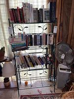 Full view of the bakers stand holding books and other items for scale and context, showing overall shape and size.