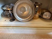 Full view of serving pieces arranged on shelf
