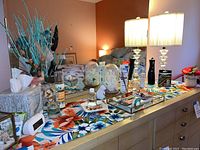 Overall view of dresser top showing all décor items and lamp