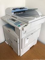 Front view photo of Ricoh Aficio MP171 multifunction printer showing control panel and paper tray
