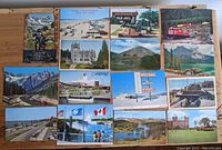 Top view showing all 15 postcards with varied scenic, historic and transportation subjects.