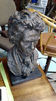 Front view of Beethoven bust showing facial features, hair texture, draped collar