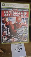 Front cover of Marvel Ultimate Alliance 2 Xbox 360 game case showing official artwork and branding