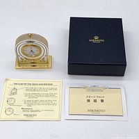 Mikimoto clock with original box, boxed instructions, and guarantee card.