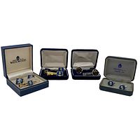 All four sets of cuff links and tie clips displayed in their boxes, two sets identified as Wedgwood.