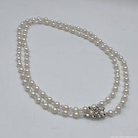 Full length of necklace laid out showing overall design