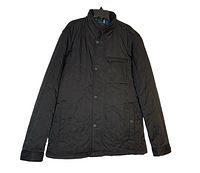 Front view of black Ted Baker London slim fit quilted jacket with snap button closure, zippered chest pocket, and side pockets
