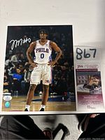 Full 8x11 signed photo of Tyrese Maxey with authentication card beside it
