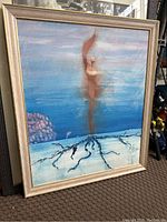Framed abstract painting showing full view with figure and root-like elements.