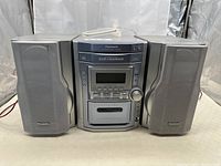 Front view of the stereo system with speakers. Shows the design and speaker positioning.