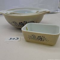 Rectangular Pyrex refrigerator dish with beige exterior and blue homestead pattern
