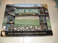 Original boxed set showing 6 miniature resin ballpark replicas arranged around a center area with text naming the ballparks on the box cover.