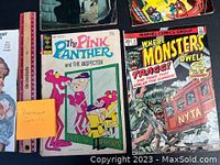Photo showing The Pink Panther and The Inspector comic and Marvel Where Monsters Dwell #23 comic along with a ruler for scale
