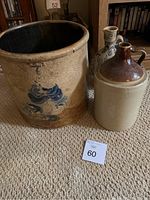 Full view of three items: large crock and two jugs on carpet floor