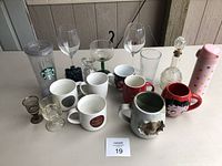All drinking containers arranged together showing variety and condition