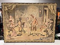 Front view of the rectangular woven tapestry showing full scene and beaded frame