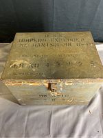 Top view showing stenciled text 'U.S. Torpedo Exploder Mechanism MK 6-19' and serial numbers with visible rust and paint wear.