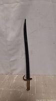 French Chassepot bayonet sheathed in black metal scabbard, standing upright
