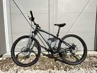 Full side view of the Specialized Hardrock mountain bike showing aluminum frame, front suspension, disc brakes and water bottle cage.