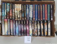 Top-down boxed view of 30 paperback science fiction fantasy books including multiple Forgotten Realms series and J.V. Jones novels.