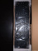 New V580 keyboard sealed in clear plastic inside original cardboard packaging.