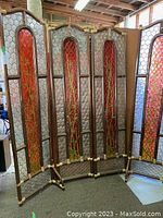 Full view of the four-panel shell and wicker room divider with red bamboo design panels.