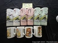 Set of 6 decorated frosted glasses with bird and wave motifs alongside 4 ceramic cups with vintage illustrations of children and animals.