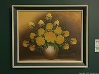 Frontal view of the framed mid century painting with yellow floral arrangement.