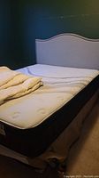 Queen bed setup with headboard, mattress, box spring, frame and duvet insert