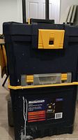 Photo of Mastercraft branded 3-piece rolling vertical toolbox in black with yellow details.