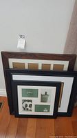 Group photo of four picture frames including a large collage frame and woodgrain frame