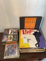 Stack of Portuguese vinyl records including Paulo de Carvalho and an English conversational record/book