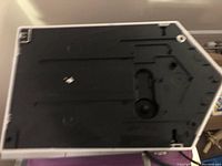 Top view of the hand dryer showing the black internal component inside a white frame, highlighting the internal sensor area and casing condition.