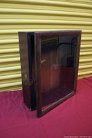 Angled view showing hinged lid open and interior