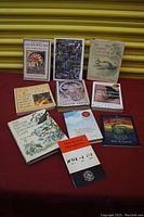 View of all books in the lot showing full front covers.