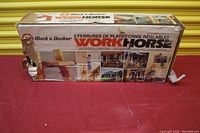 Front view of original worn box with images showing how the brackets can be used, text in English and French.