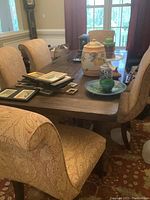 Group of six chairs around a dining table